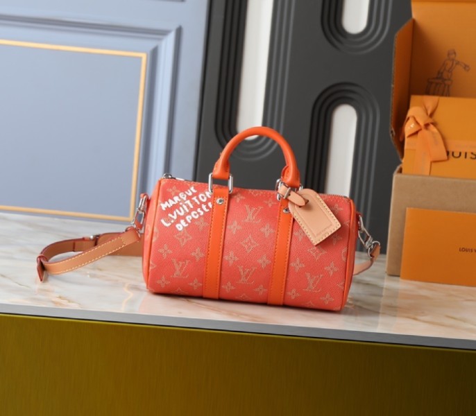 Replica Louis Vuitton LV Monogram Heritage Canvas Keepall Bandouliere 25 In Lava Orange M26818